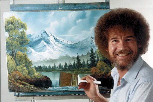 bob ross smiling beside his beautiful work