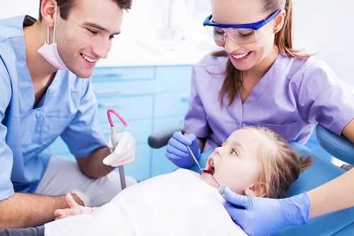 Dentists And Little Girl